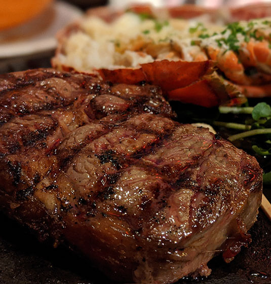 half cow grilled delmonico steaks with lobster